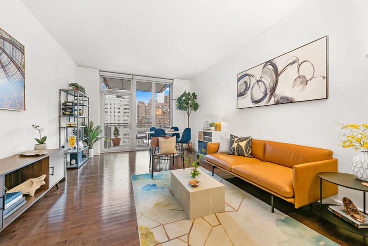 This one-bed condo in Murray Hill's Charleston is asking $1.15M and has central air, a private balcony, and a washer/dryer. 