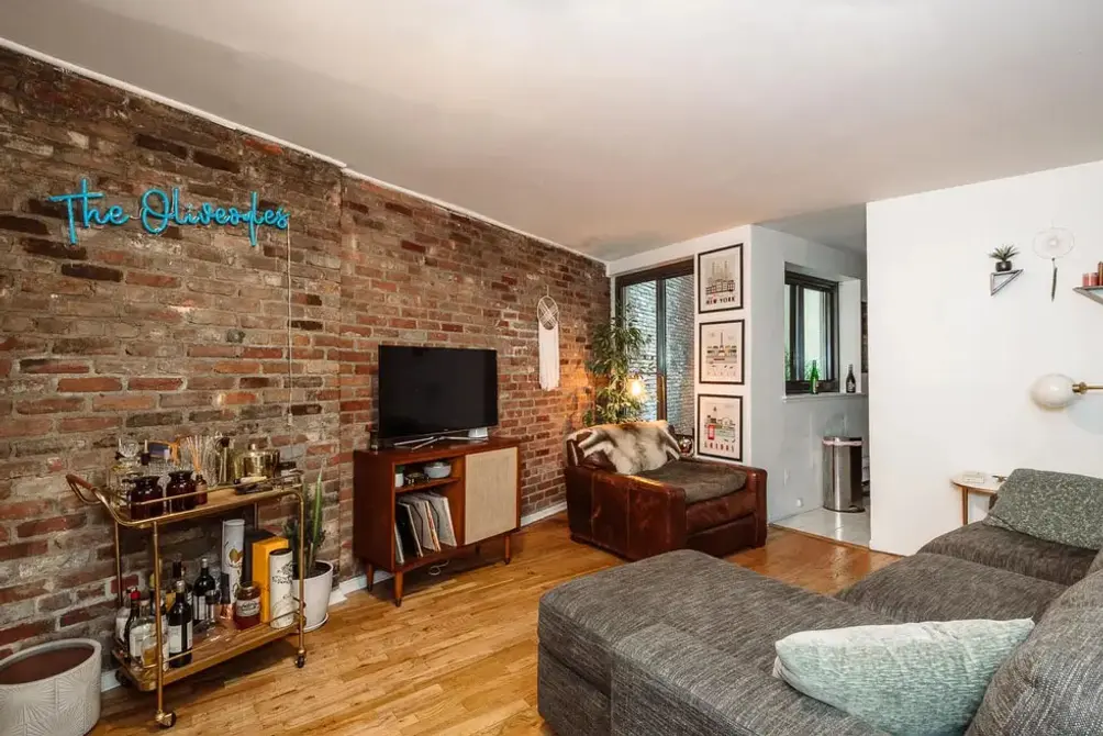Living room with exposed brick wall