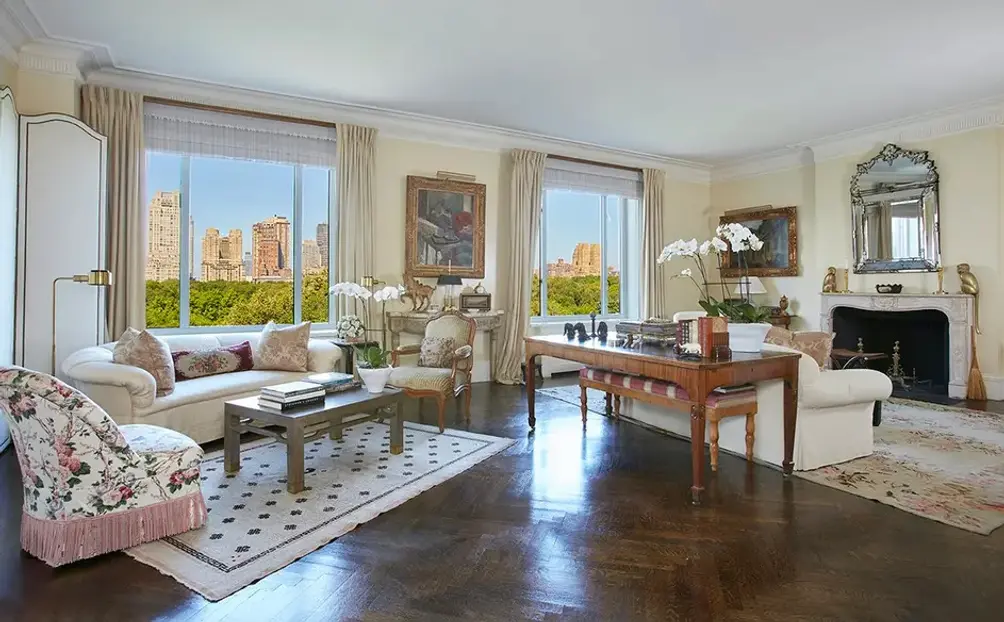 Living room with ornately carved fireplace and Central Park views