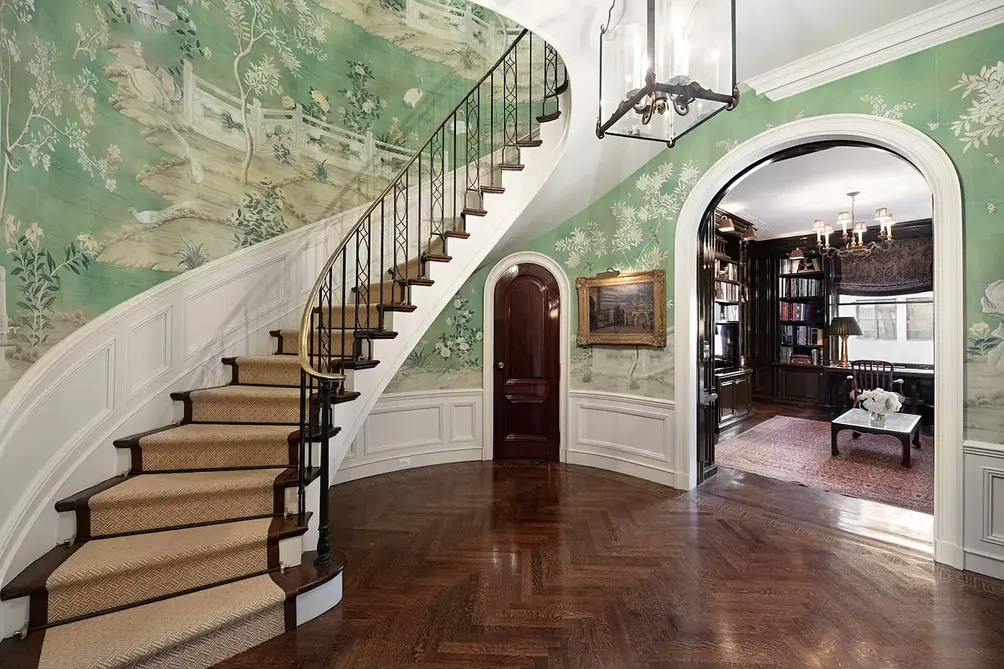 812 Park Avenue foyer with curved staircase and arched entry