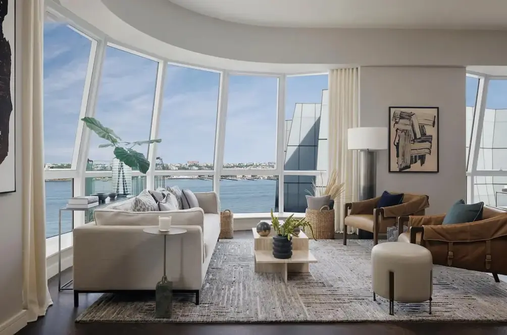 Living room with bay window and river views