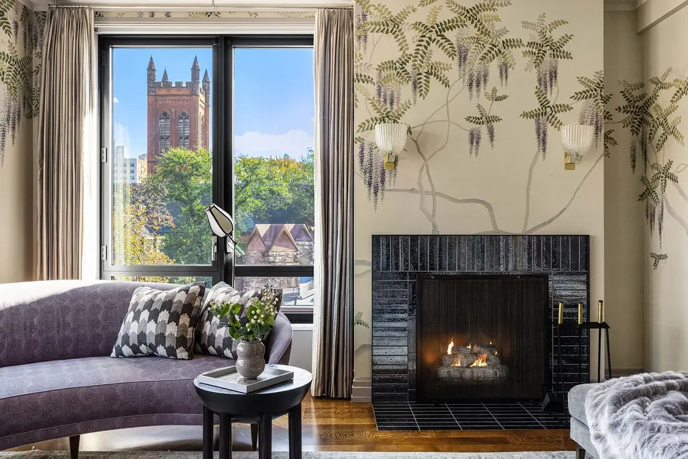 Living room with fireplace and oversized windows