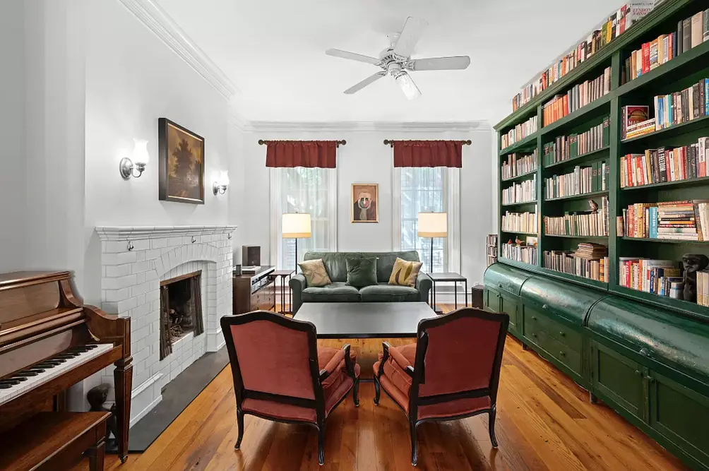 Living room with brick-lined fireplace