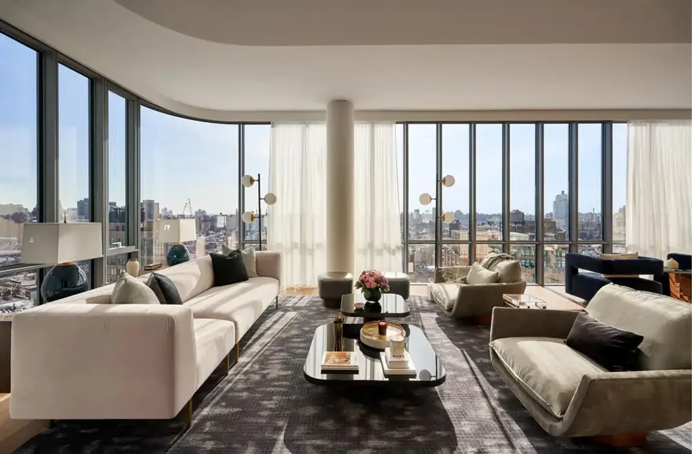 Living room with curved floor-to-ceiling windows