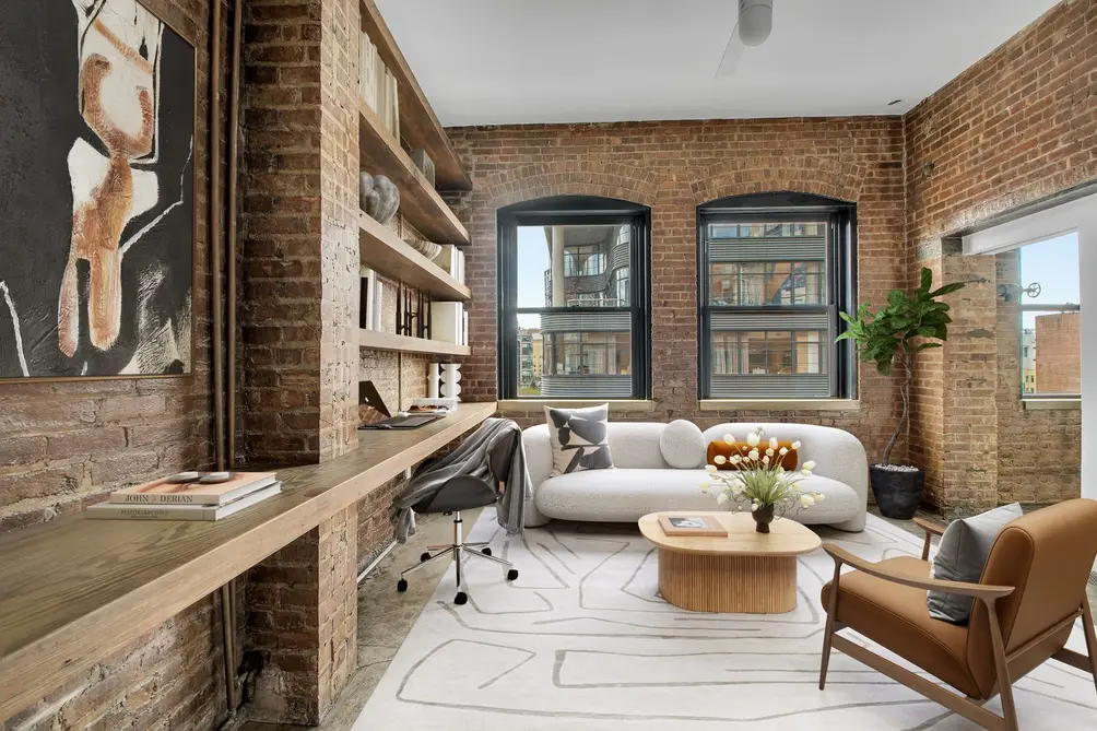Study with exposed brick wall