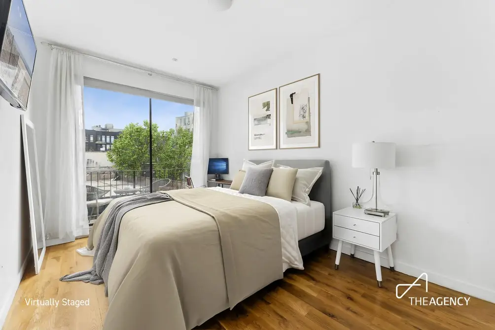 Primary bedroom with balcony access