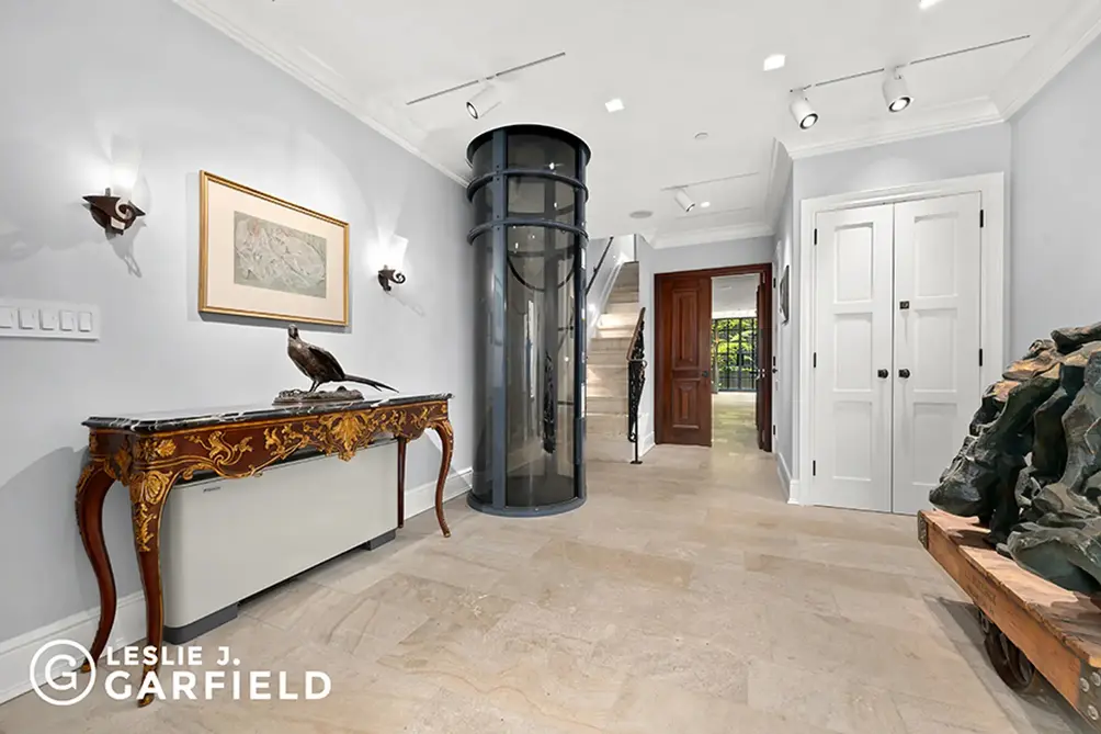 Foyer with elevator and staircase