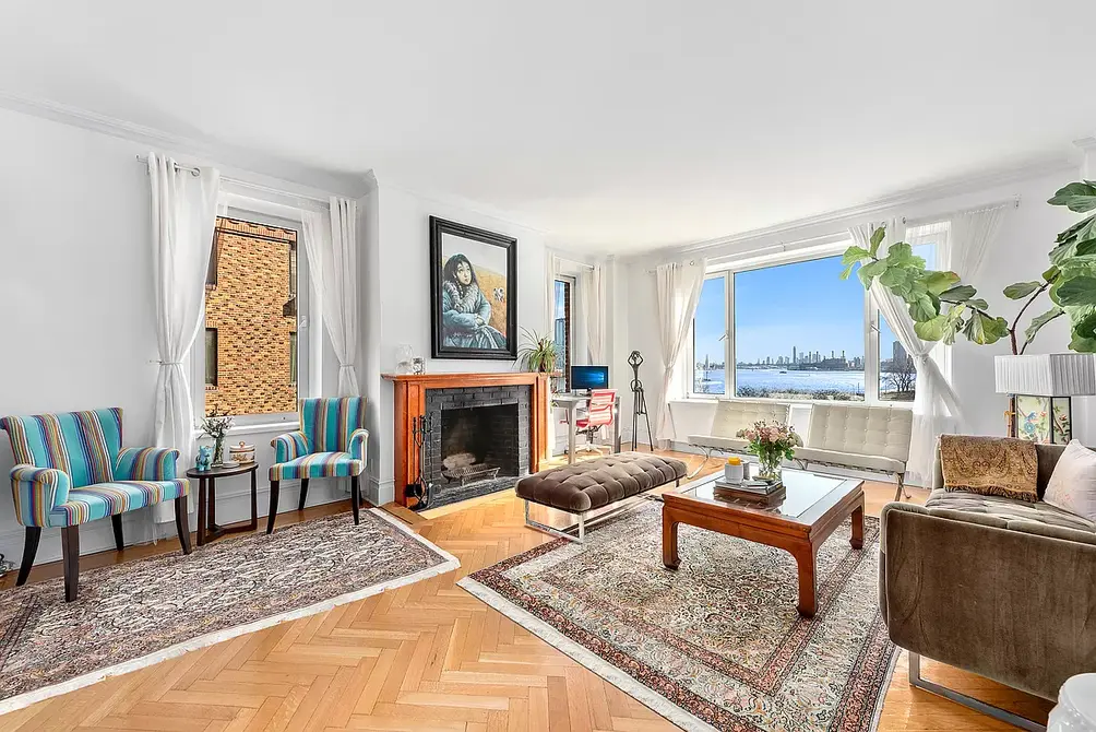 Living room with fireplace and East River views