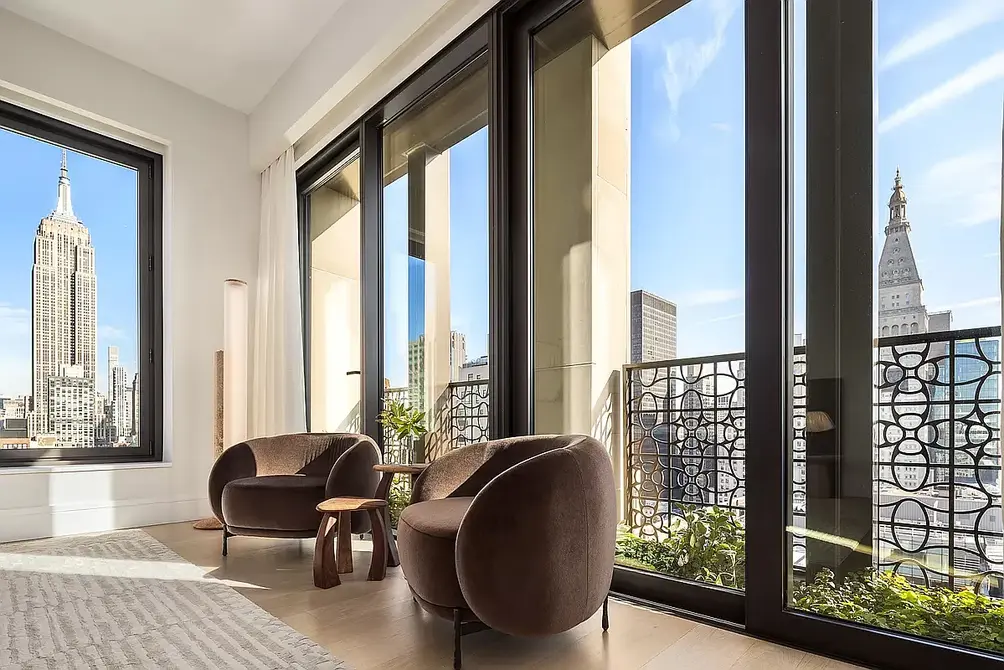 Corner living room with Empire State Building views and planted loggia