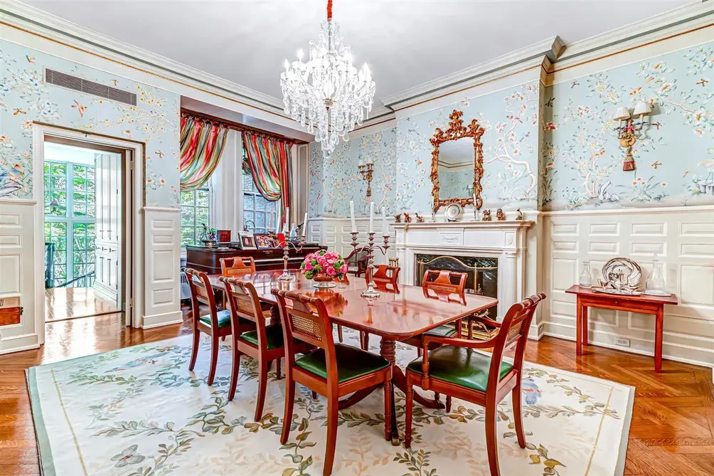 Formal dining room with fireplace and chandelier