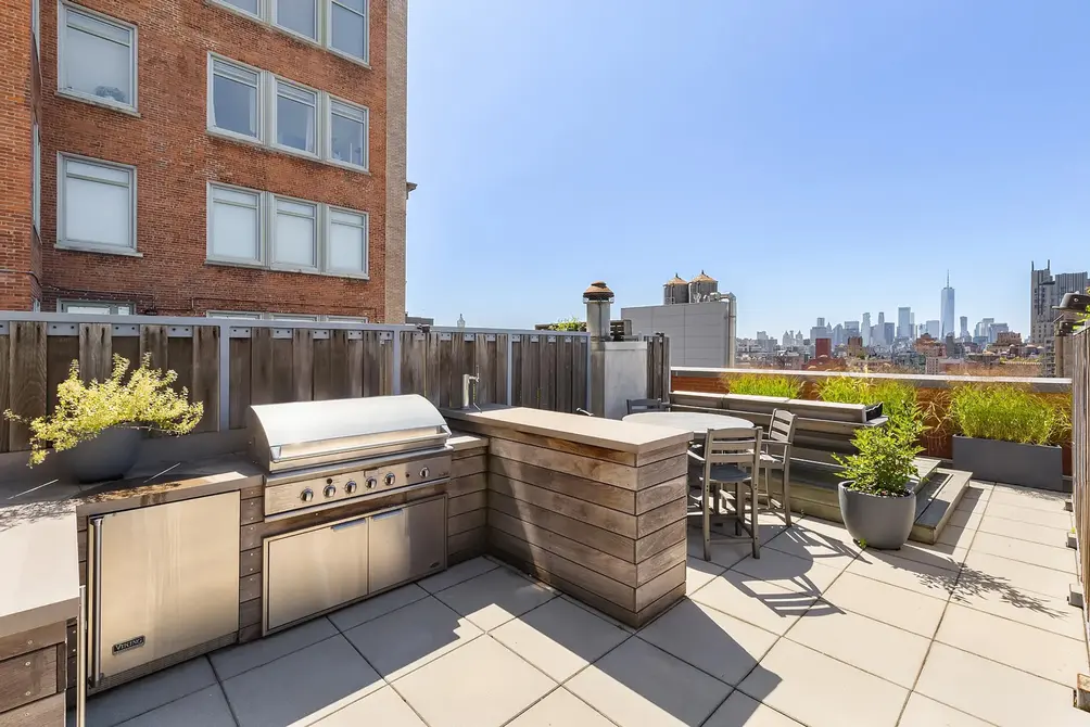 Private terrace with outdoor kitchen and Lower Manhattan views
