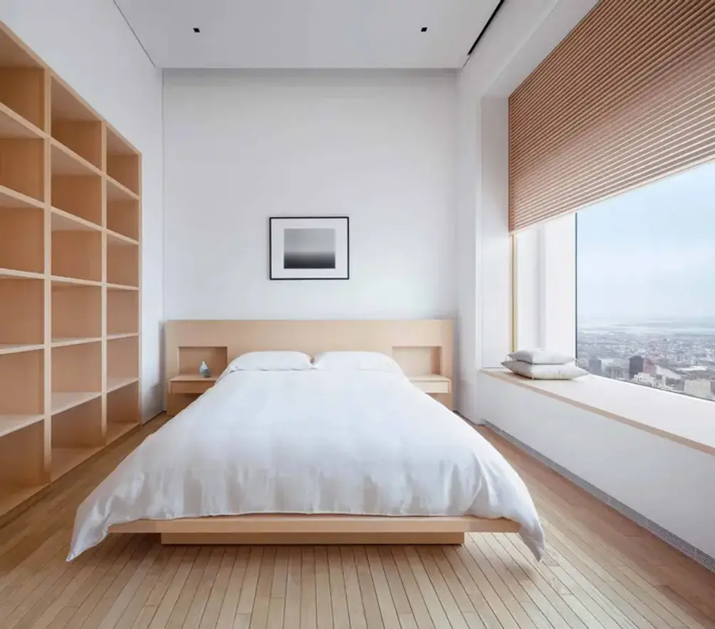 Secondary bedroom with built-in shelving and custom platform bed