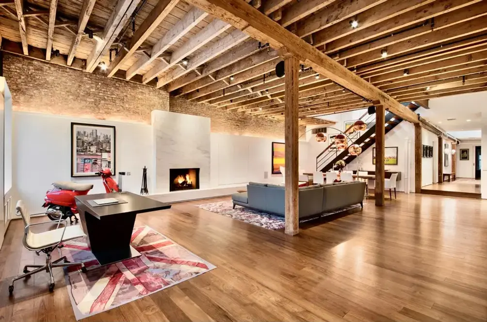 Interiors with fireplace and exposed beams and columns