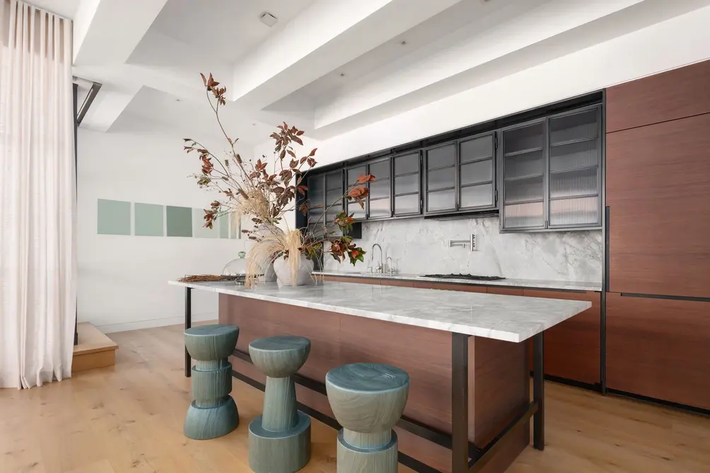 Open kitchen with island and beamed ceiling