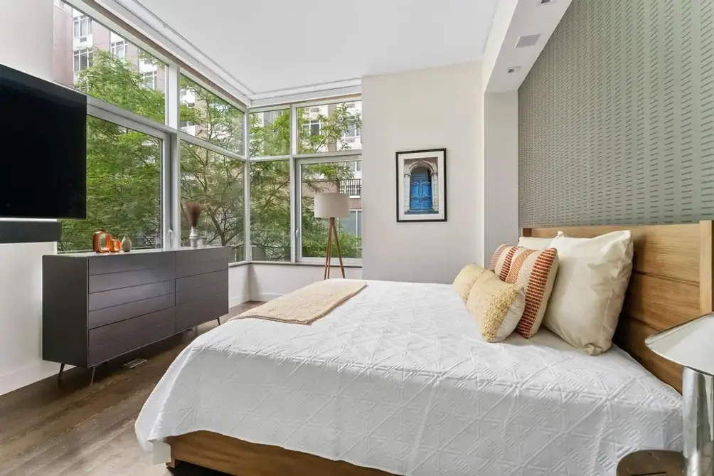 Corner bedroom with oversized windows