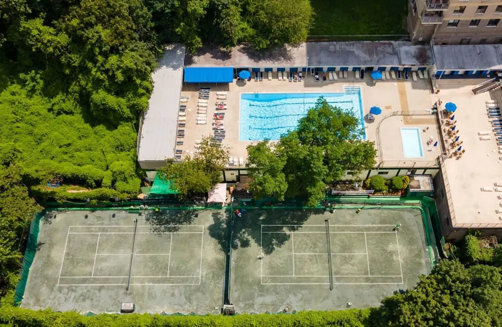 Aerial view of tennis courts and outdoor pool