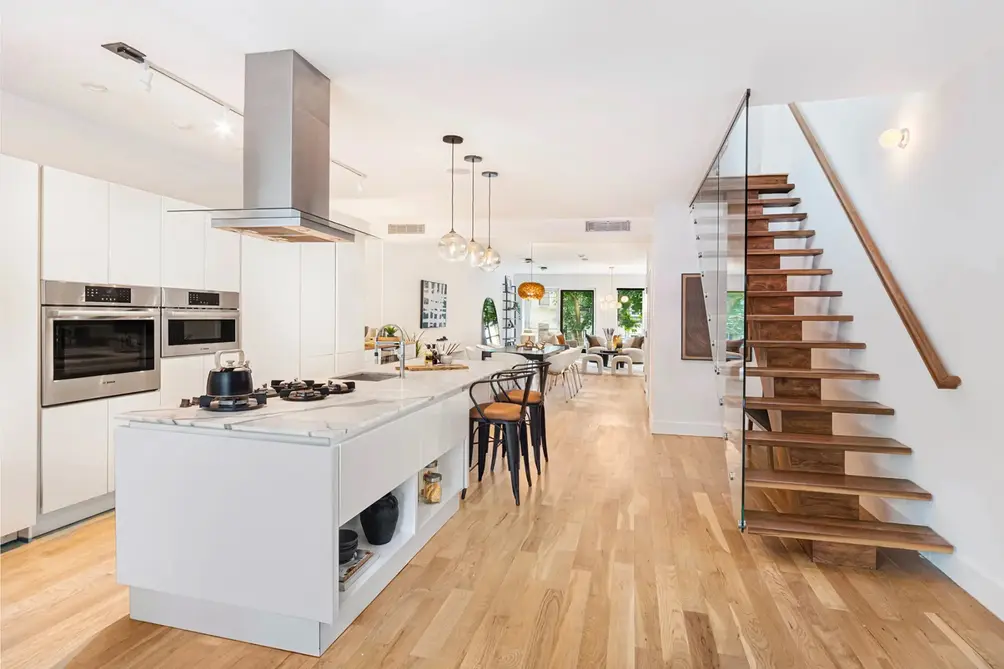 Kitchen with staircase and center island