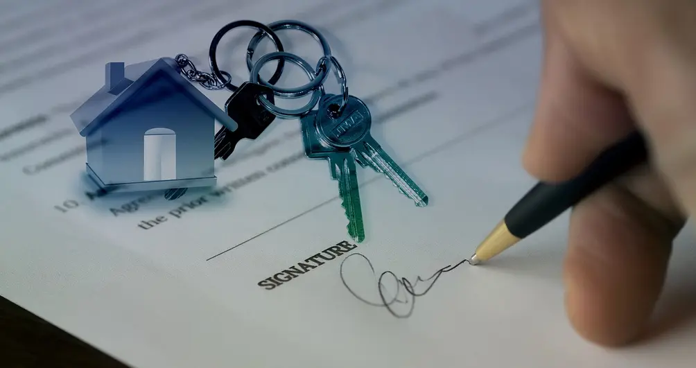 Signature on a contract accompanied by house keys