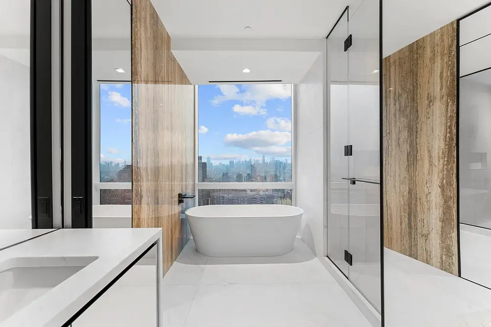 Primary bath with freestanding tub by the windows