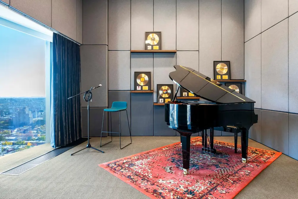 Music room with piano and floor-to-ceiling windows