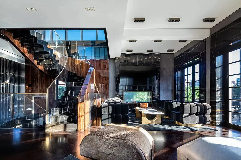 Living room with staircase and terrace access