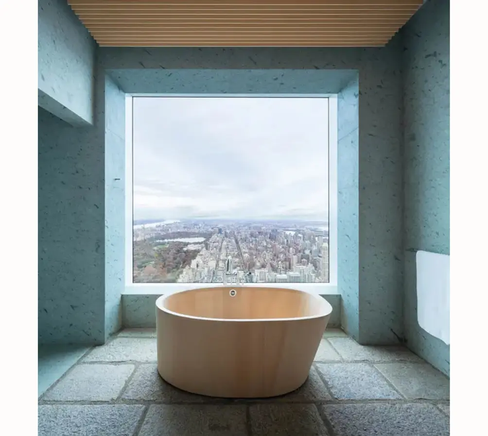 Primary bath with cedar soaking tub and Central Park views