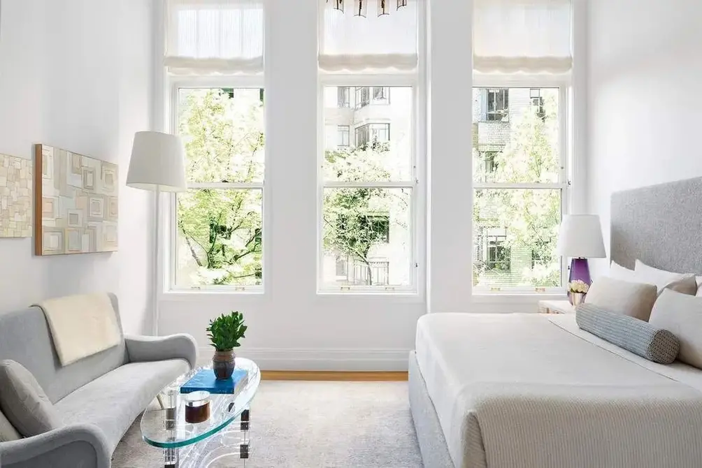 Primary bedroom with oversized windows