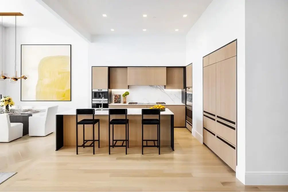 Open kitchen with center island and integrated appliances