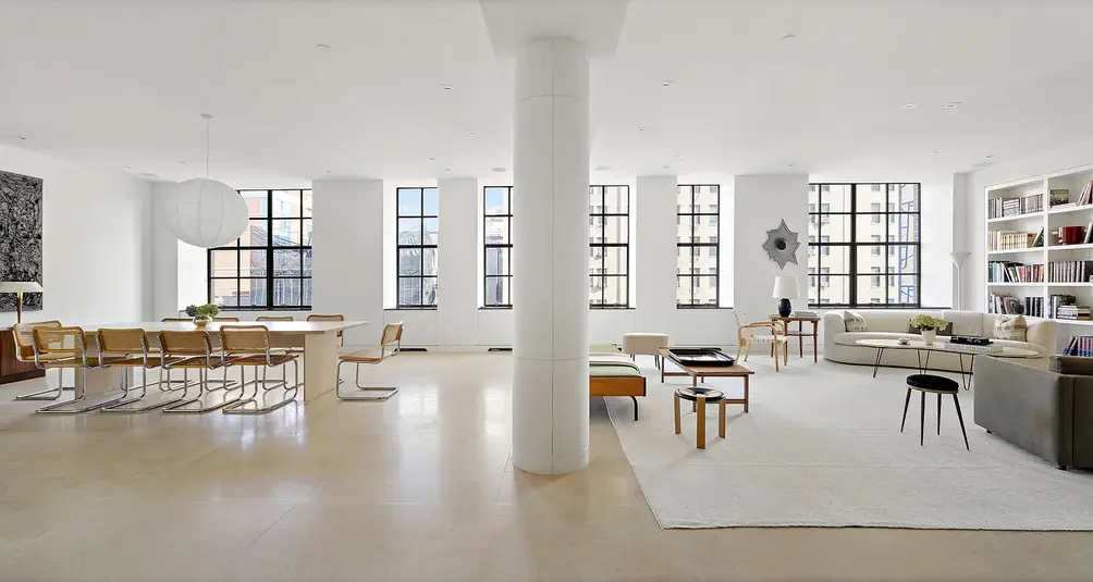 Living/dining room with casement windows and column