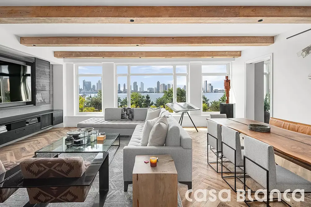 Living room with exposed beams and Hudson River views