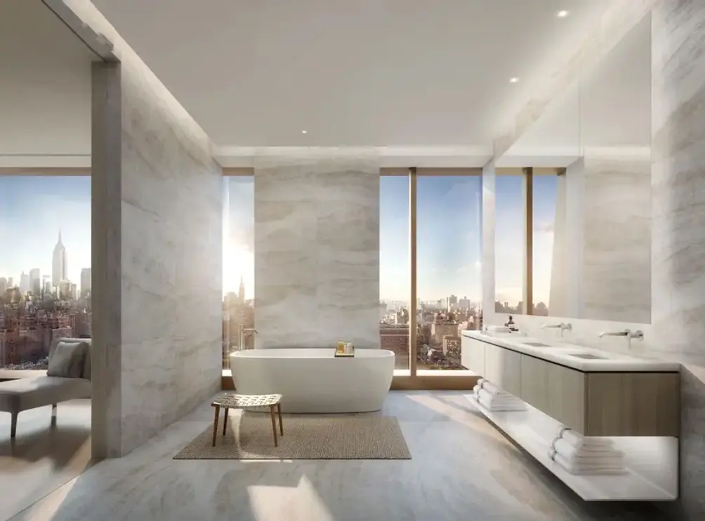 Primary bath with separate soaking tub and Lower Manhattan views