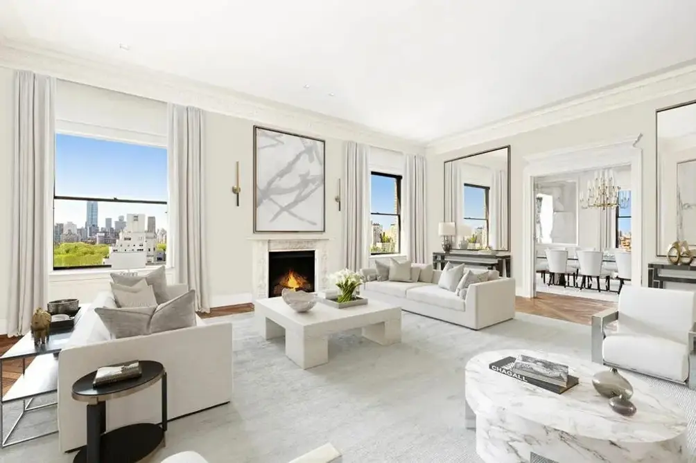 Corner living room with fireplace and Central Park views