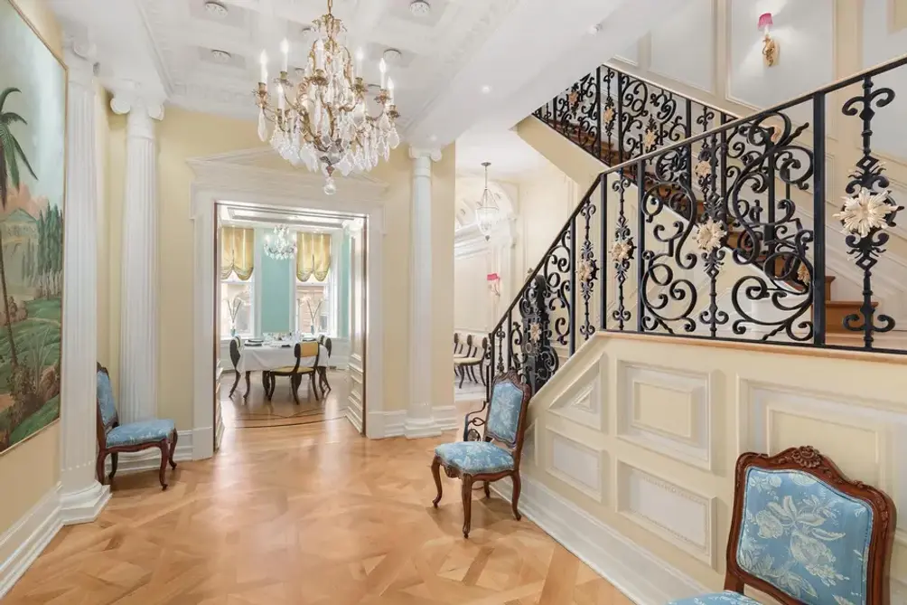 Entrance foyer with wrought iron staircase
