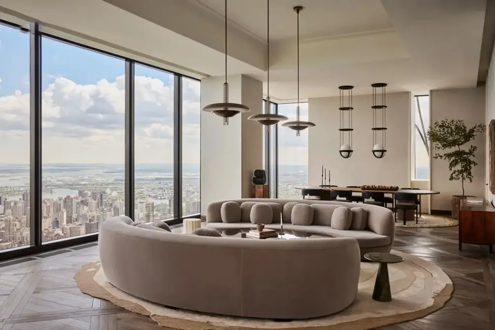 Penthouse with wall of windows facing the city skyline