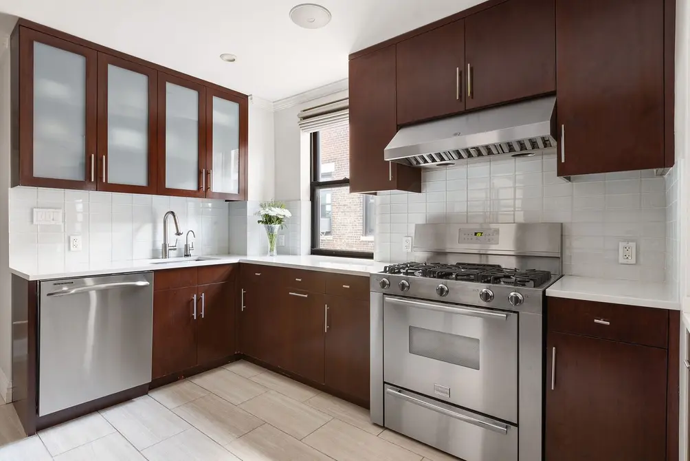 Windowed kitchen with stainless steel appliances
