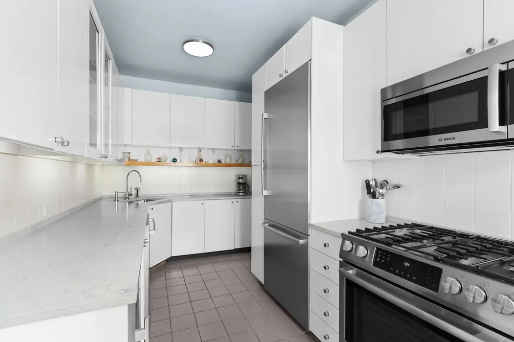 Separate kitchen with stainless steel appliances