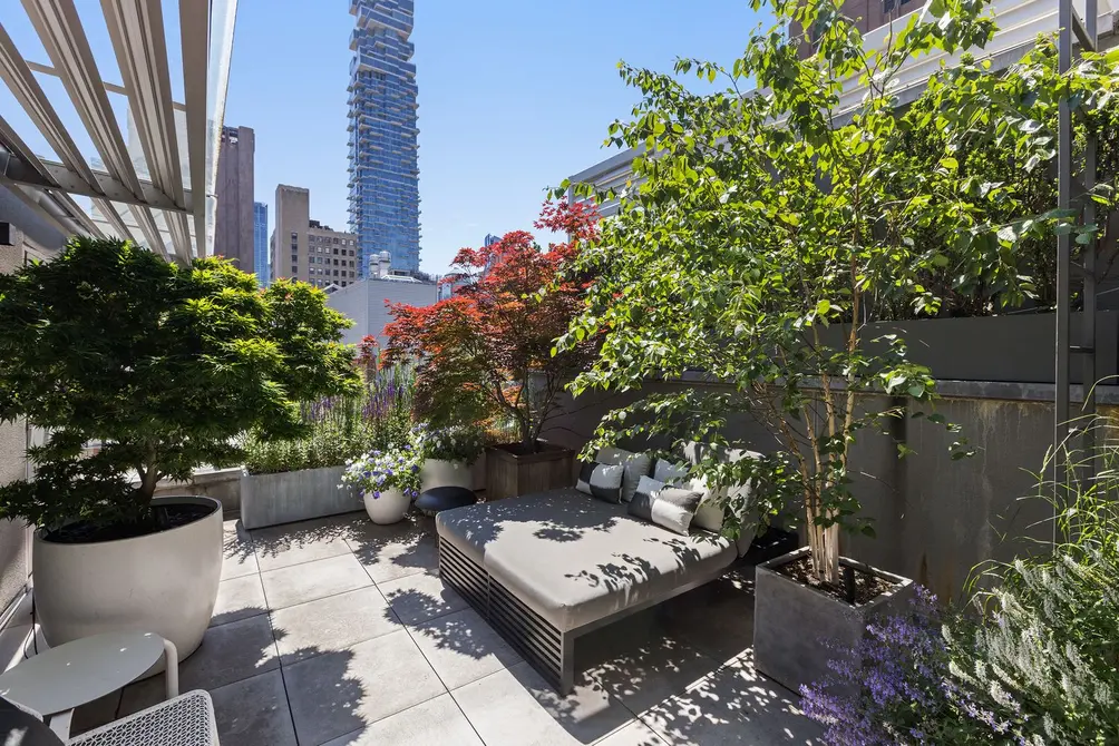 Private terrace with landscaping and skyline views