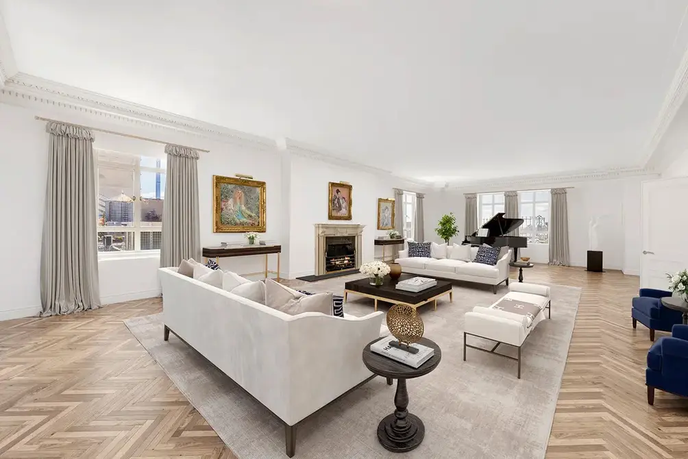 Living room with fireplace and herringbone floors