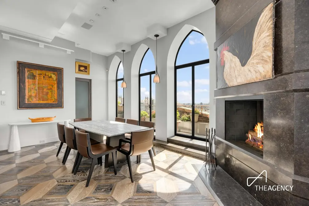 Dining room with arched windows and fireplace