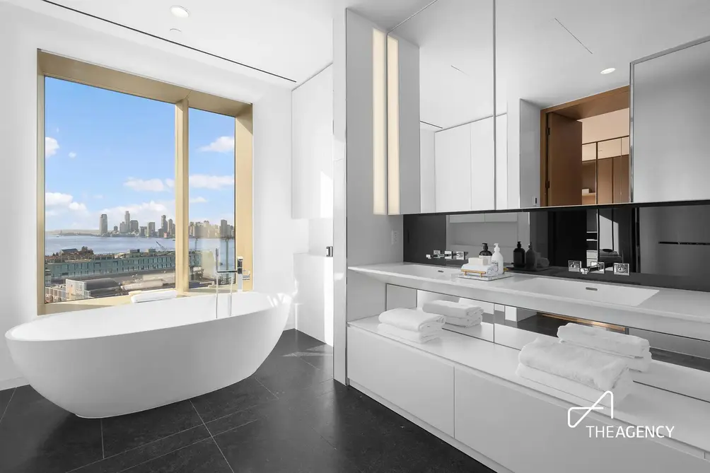 Primary bath with free-standing tub and Hudson River views