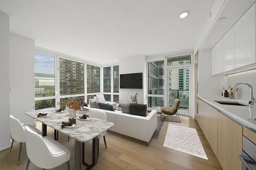 Living room and open kitchen with balcony access