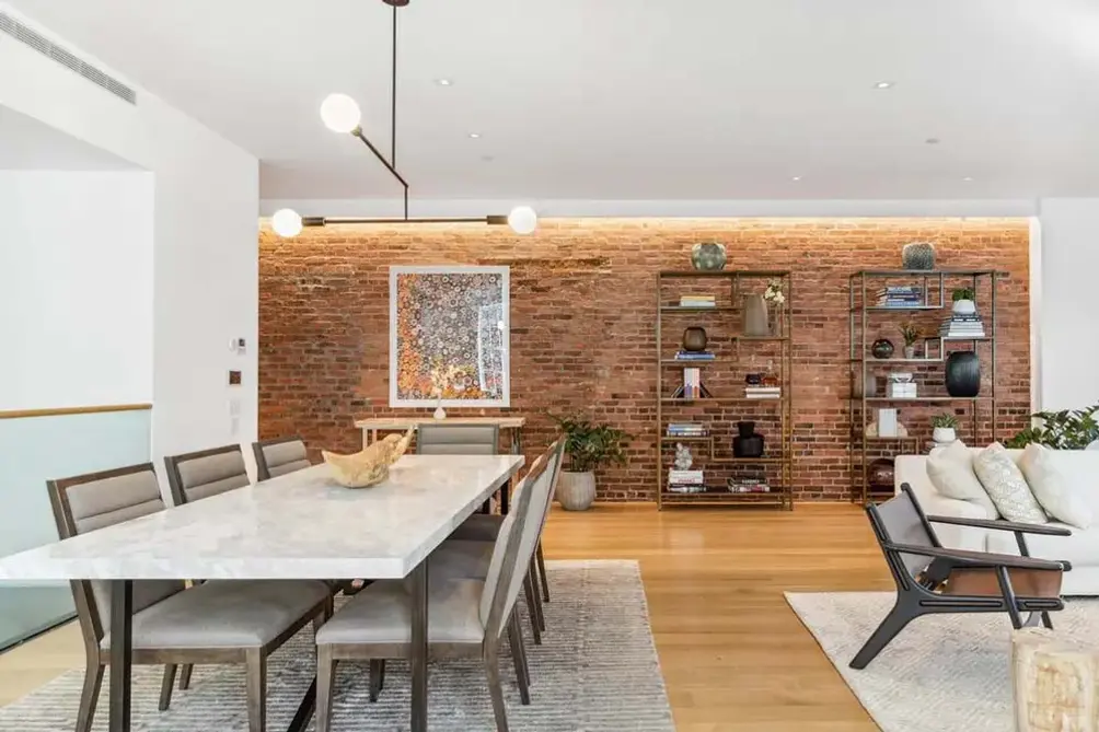 Dining area with exposed brick wall