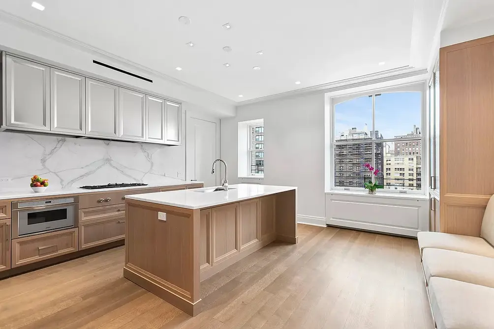 Open, windowed kitchen with center island