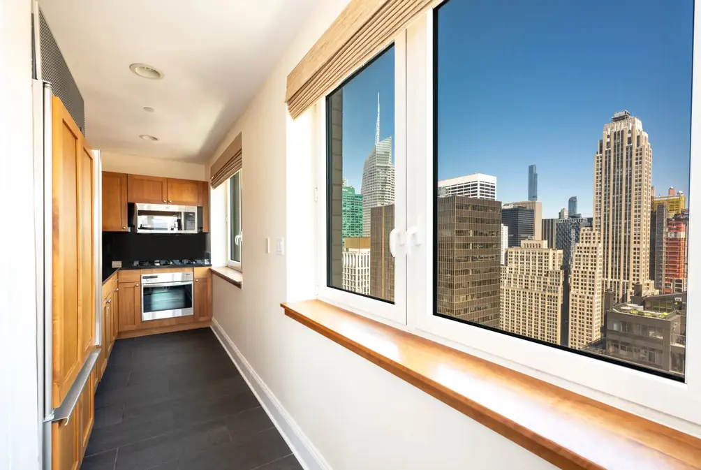 Windowed kitchen with city views