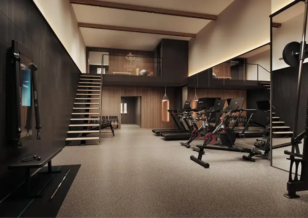 Double-height fitness center with mezzanine yoga area