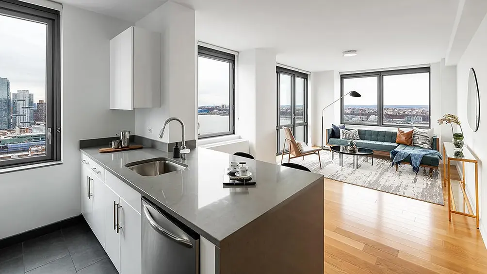 Living room and open kitchen with river views