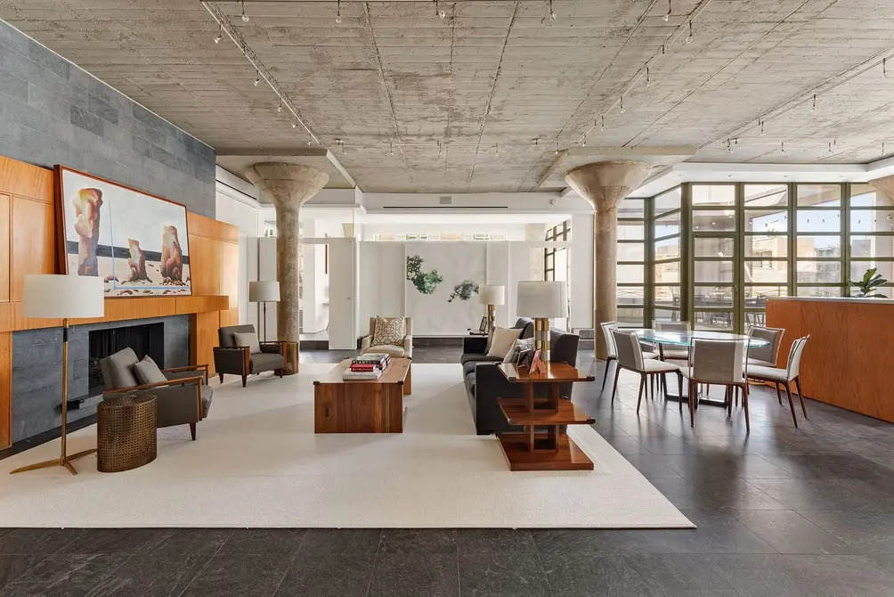 Living room with concrete ceiling and exposed columns