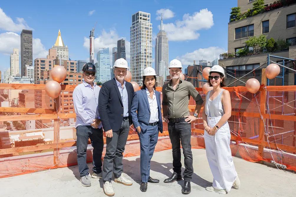 Development and design team of Hendrix House on the roof