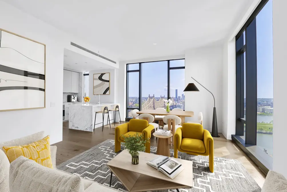Living room with open kitchen and East River views