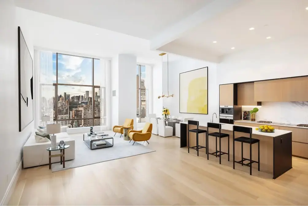 Living room with oversized window and open kitchen